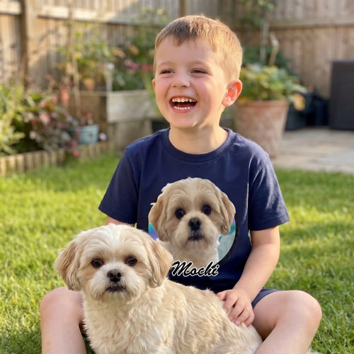 Boy in the garden in a navy kids' custom pet photo t-shirt with his Shih Tzu on his lap