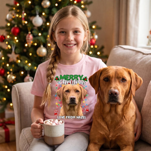 Girl with hot chocolate by the tree in a light pink kids' personalised Christmas pet face t-shirt