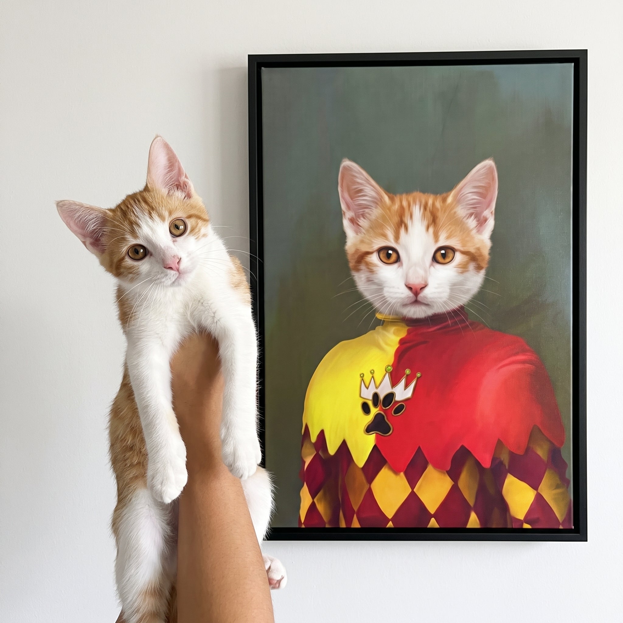 Ginger and white cat next to its The Jester custom pet canvas